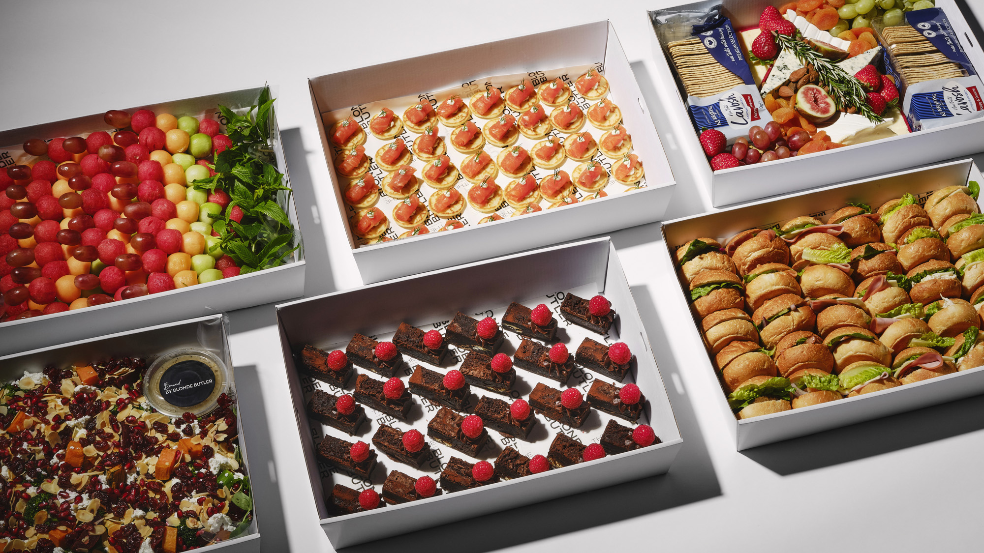 A selection of Boxed by Blonde Butlers ready made boxes for seamless drop off catering.