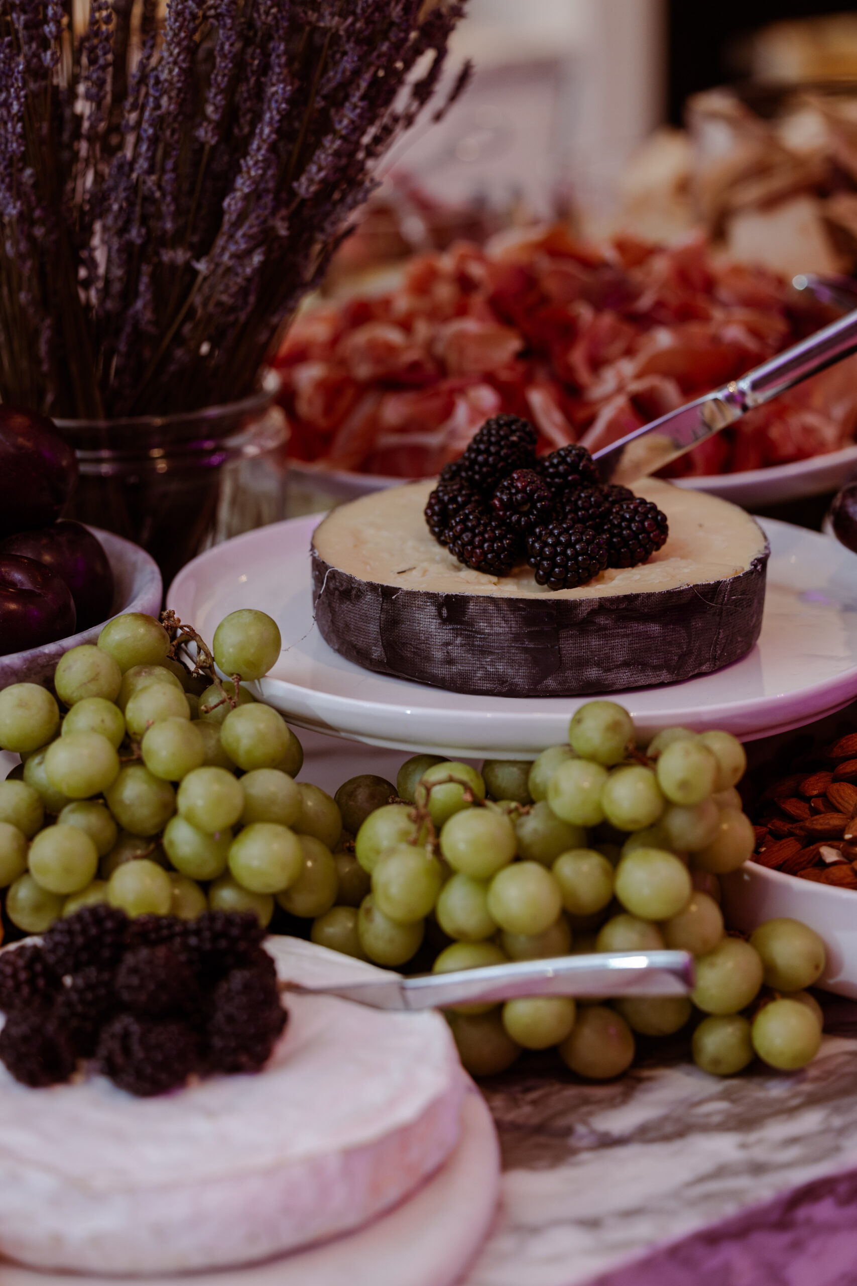 Cheese and fresh fruit grazing table by The Blonde Butler.