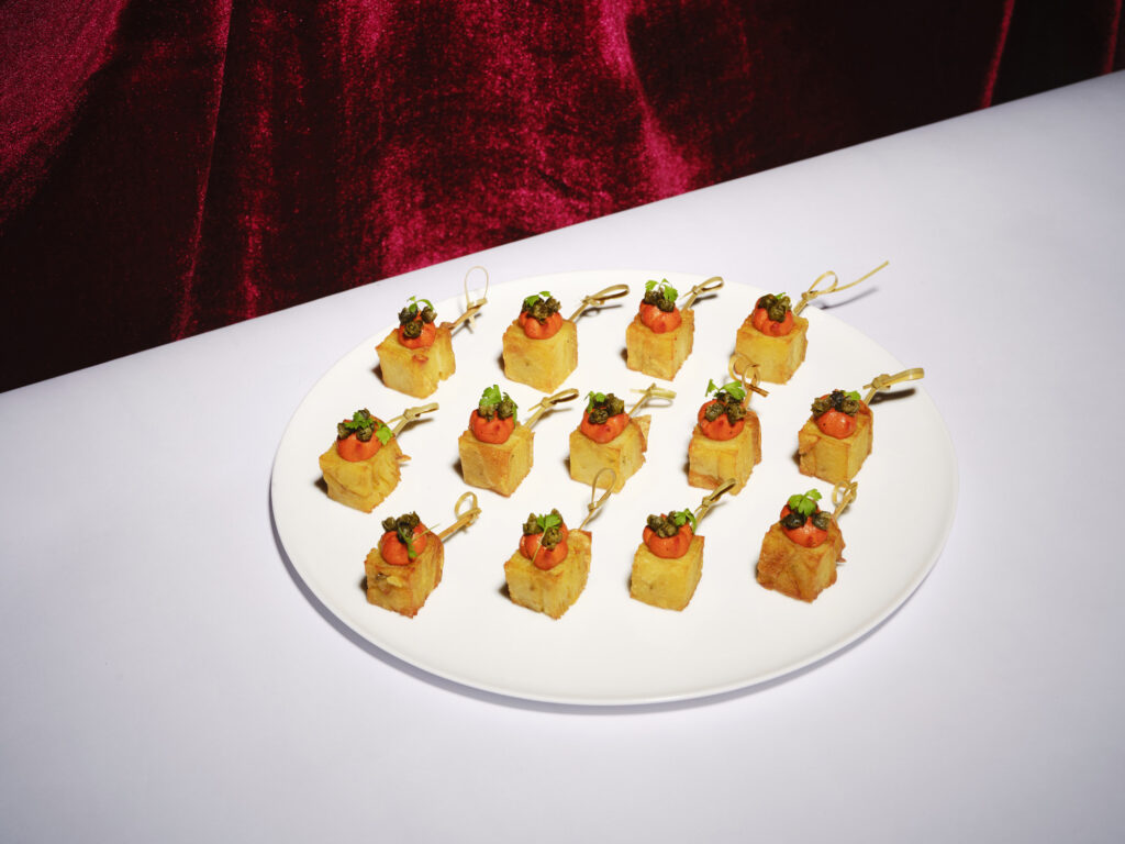 Crispy pomme Annas with smoked romesco & fried capers canapé
